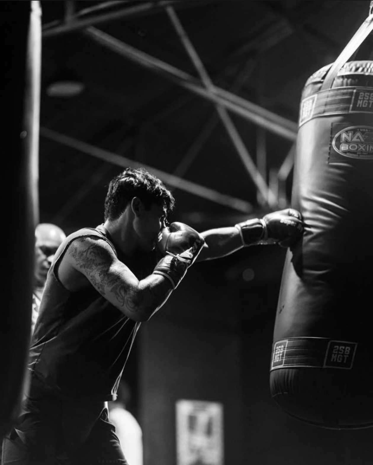 Combat athlete training on a heavy bag