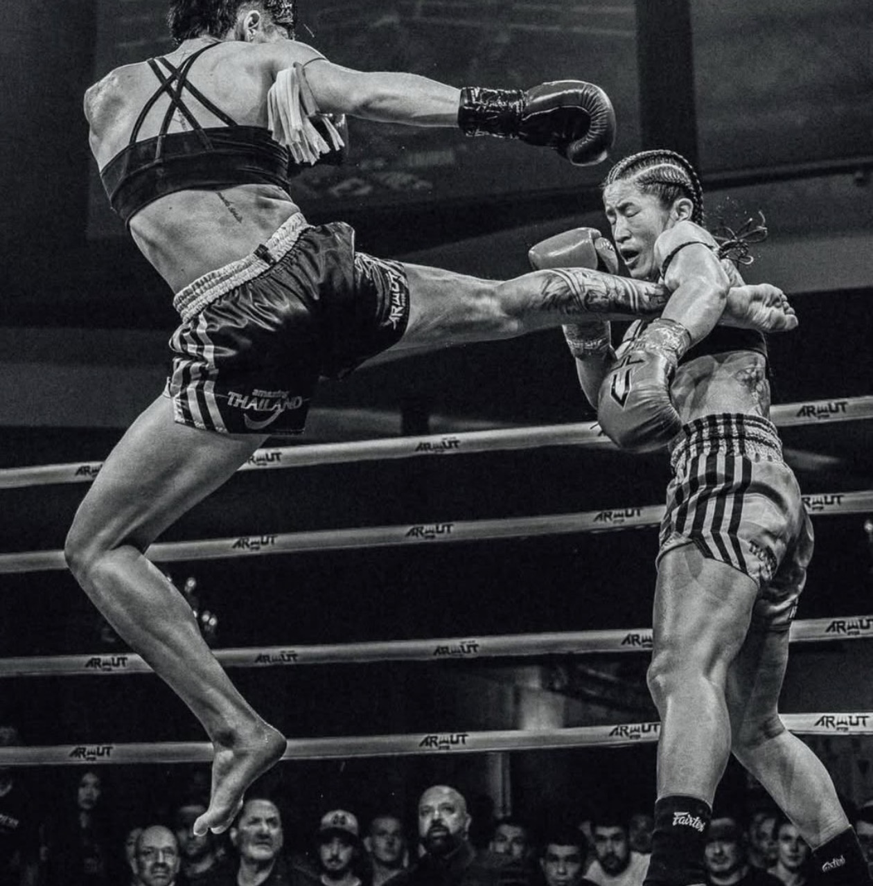 Combat athlete landing a kick in competition